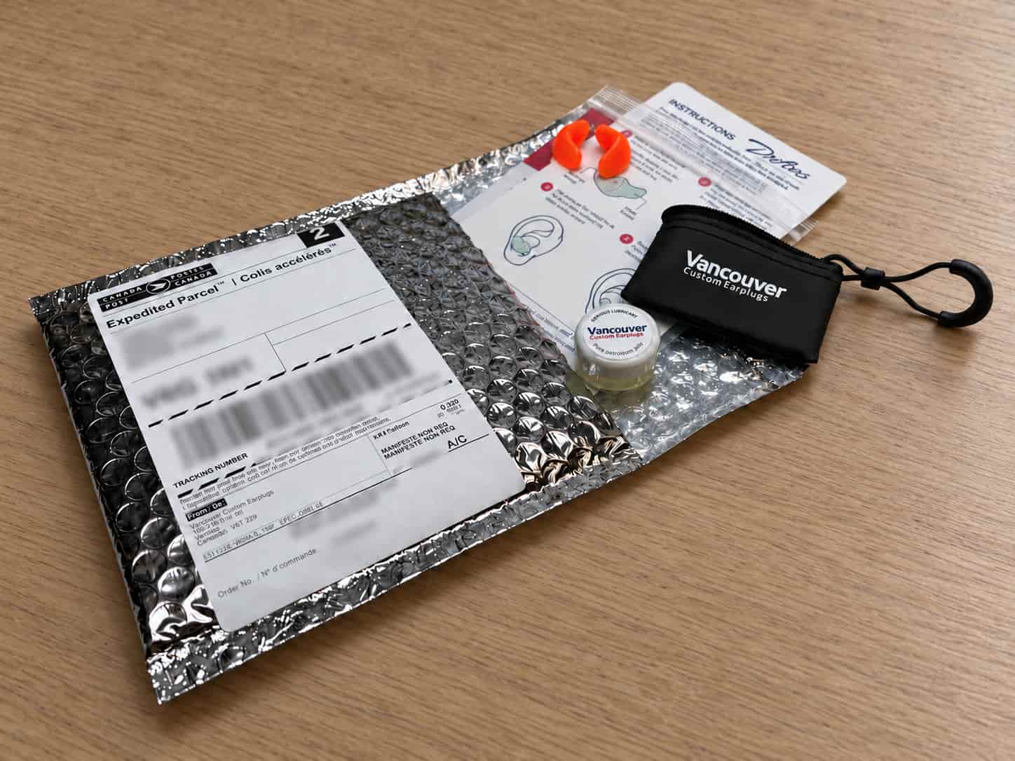 Package containing custom earplugs and instructions.