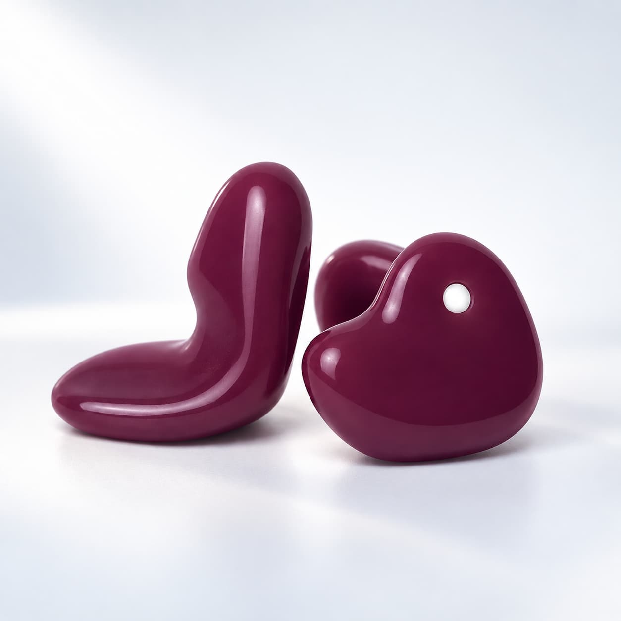 Pair of plum coloured custom sleep earplugs